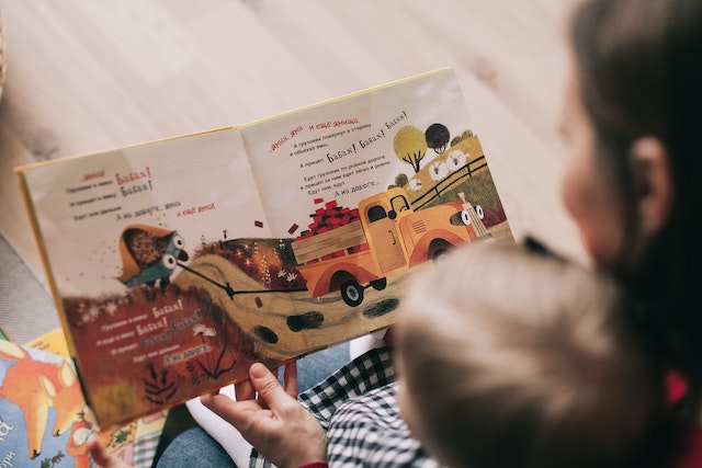 A mother reading a story to her child.