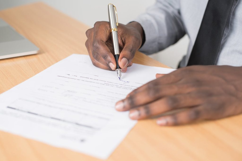 person filling in paperwork for types of nonprofit organizations