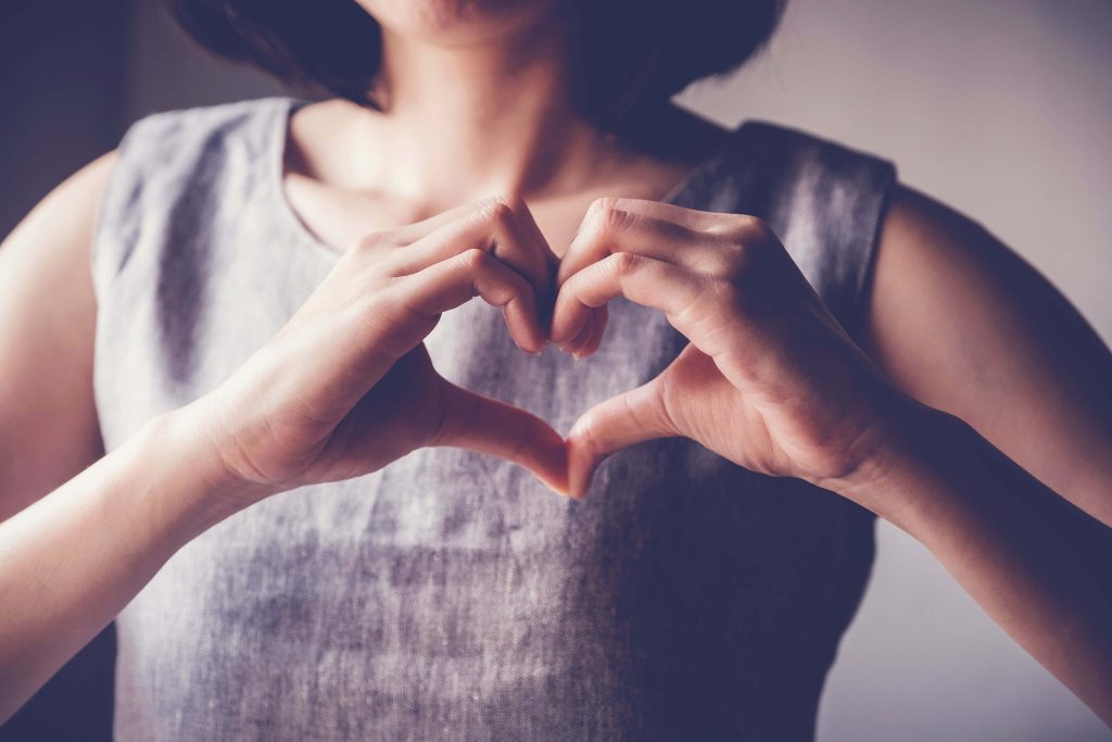 Woman making a heart with her hands